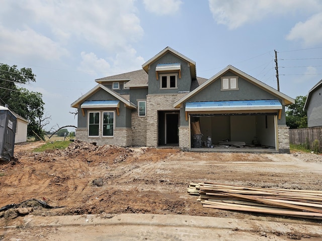 32710 Fly Fish Way, Fulshear, TX 77441 - view of front of home featuring stucco siding, driveway, and a garage