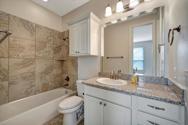 full bath with vanity, toilet, and bathtub / shower combination