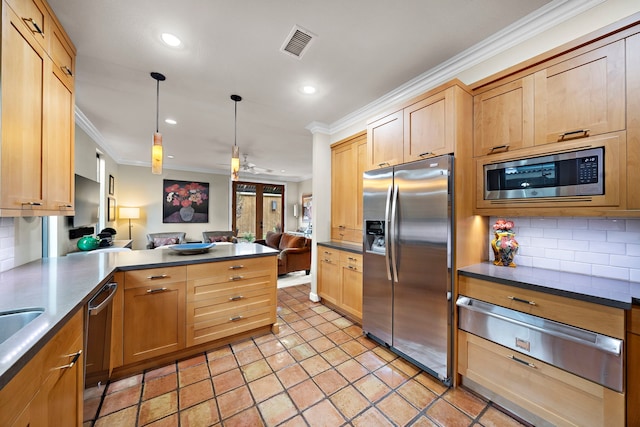 kitchen featuring open floor plan, appliances with stainless steel finishes, ornamental molding, and a warming drawer