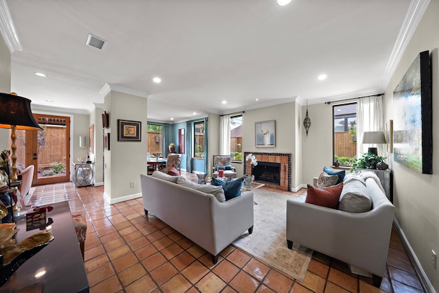 living area with visible vents, recessed lighting, crown molding, and a tile fireplace