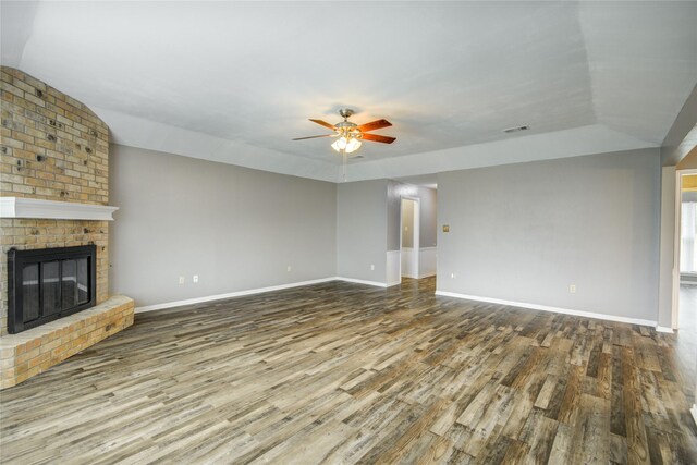 unfurnished living room with visible vents, baseboards, ceiling fan, and wood finished floors