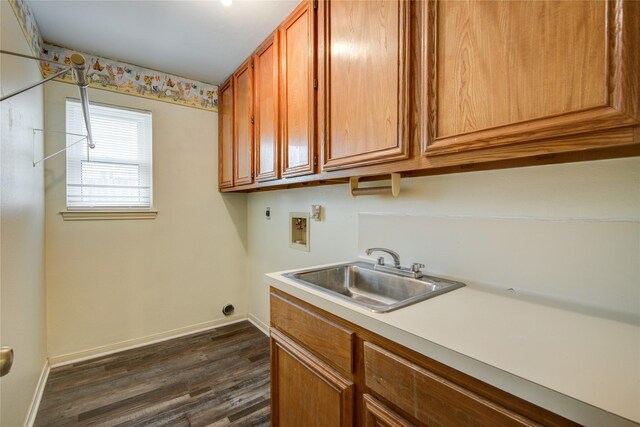 washroom with cabinet space, dark wood-style flooring, washer hookup, a sink, and electric dryer hookup