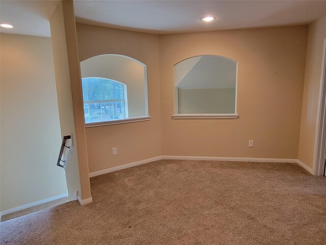 empty room with baseboards, carpet flooring, and recessed lighting