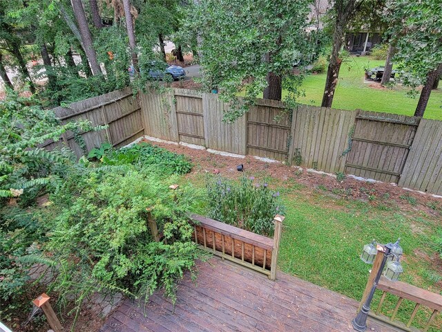 view of yard featuring a wooden deck and a fenced backyard