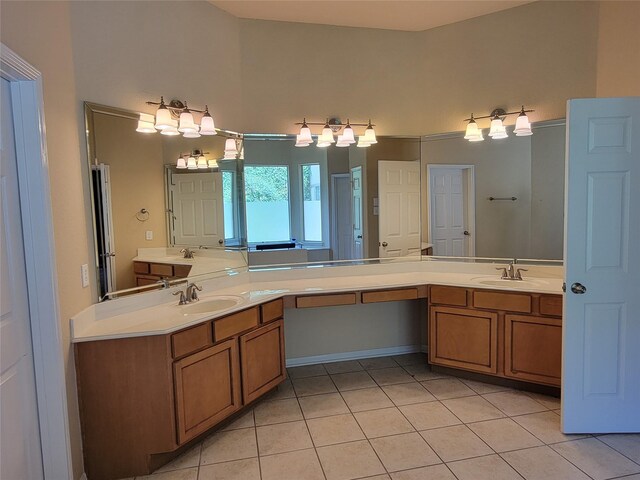 bathroom with tile patterned flooring and vanity