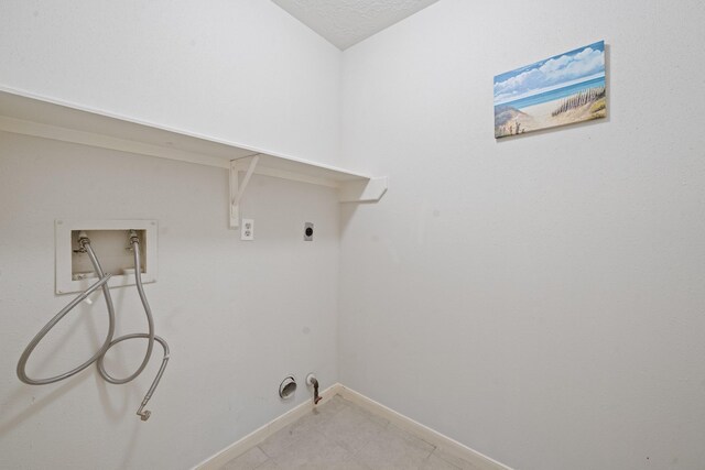 laundry room featuring laundry area, hookup for a washing machine, hookup for a gas dryer, electric dryer hookup, and baseboards