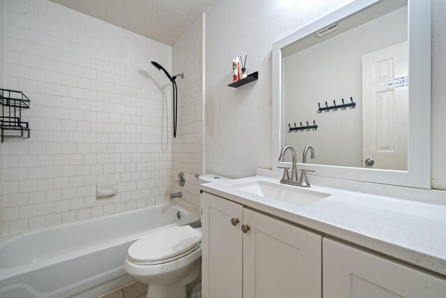 full bathroom featuring vanity, toilet, a textured ceiling, and  shower combination