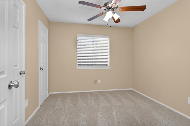 unfurnished bedroom featuring carpet floors, baseboards, and a ceiling fan