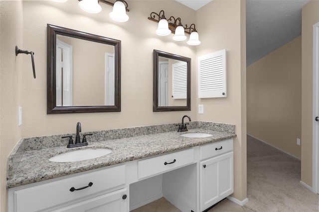 4807 Bridgemont Ln, Spring, TX 77388 - bathroom featuring double vanity and baseboards