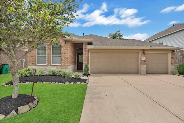 ranch-style house featuring a front lawn, brick siding, a shingled roof, an attached garage, and driveway