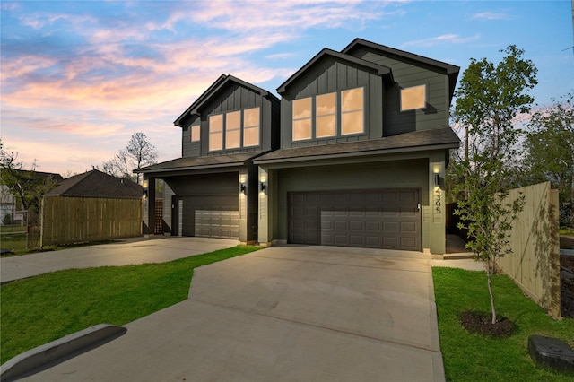 4305 Stassen St, Houston, TX 77051 - view of front of home featuring board and batten siding, a garage, fence, a front lawn, and concrete driveway