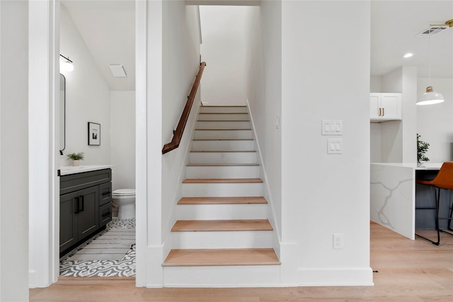 4305 Stassen St, Houston, TX 77051 - stairs with visible vents, recessed lighting, and wood finished floors