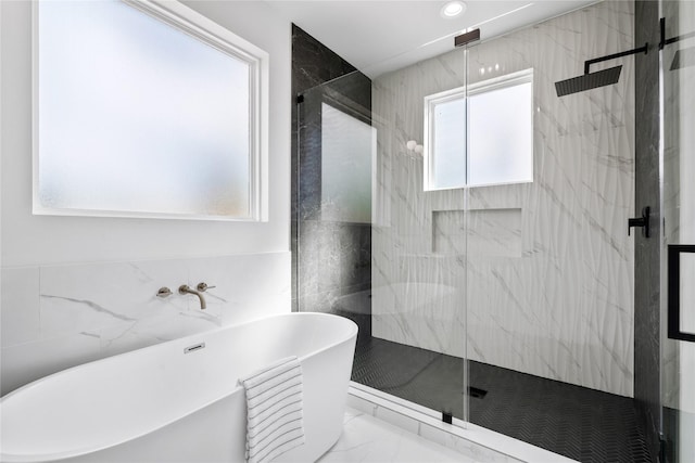 4305 Stassen St, Houston, TX 77051 - full bath featuring a soaking tub, recessed lighting, a marble finish shower, and marble finish floor