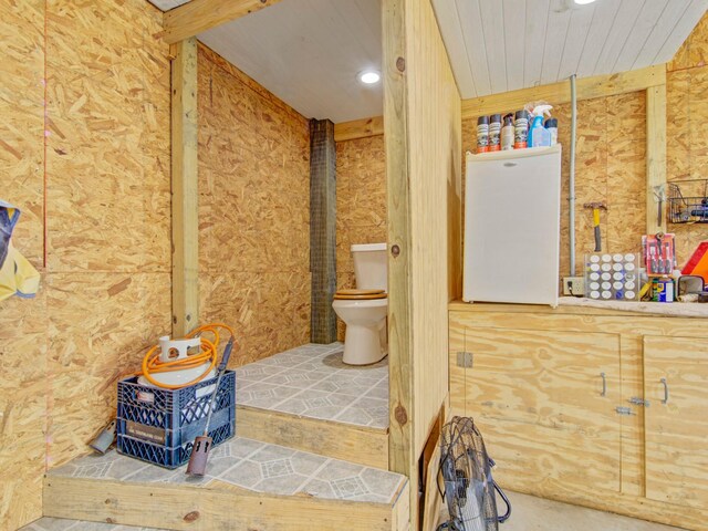 bathroom featuring recessed lighting and toilet
