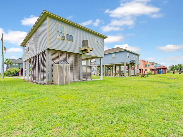back of property with a yard