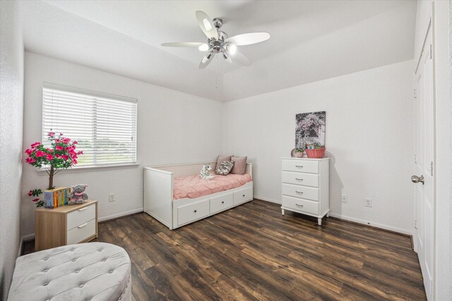 bedroom featuring baseboards, dark wood-style floors, and ceiling fan