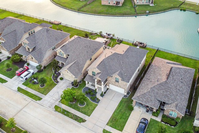 aerial view featuring a water view and a residential view
