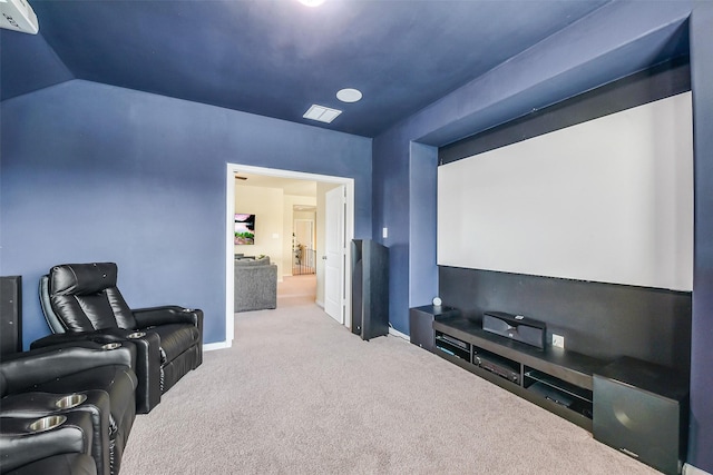 home theater room with carpet floors, baseboards, and visible vents