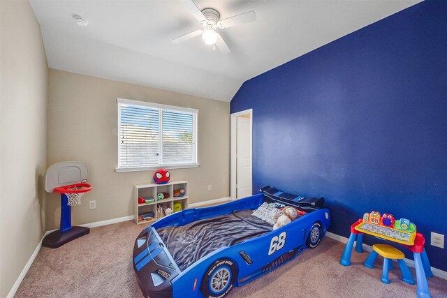 carpeted bedroom featuring baseboards, a ceiling fan, and lofted ceiling