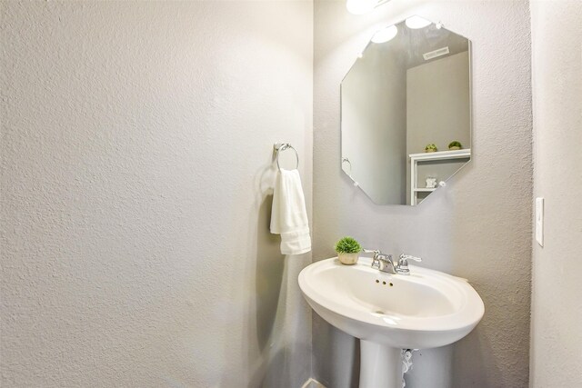 bathroom with a sink and visible vents