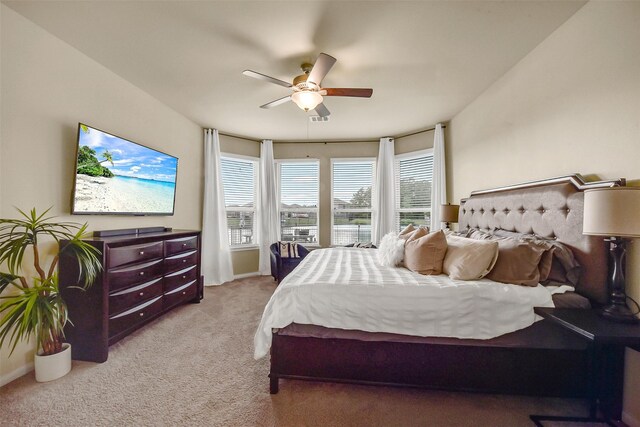bedroom featuring ceiling fan, baseboards, and carpet