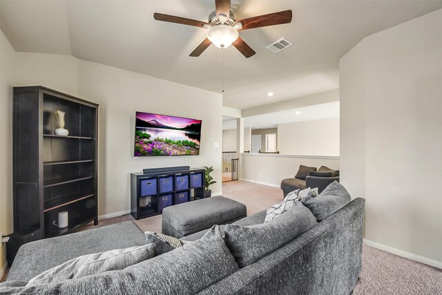 carpeted living room with baseboards, ceiling fan, and visible vents