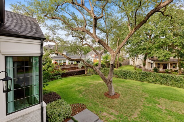 view of yard with fence and a residential view