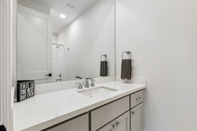 full bath featuring visible vents, recessed lighting, walk in shower, and vanity