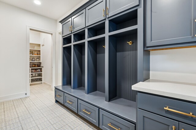 mudroom featuring baseboards
