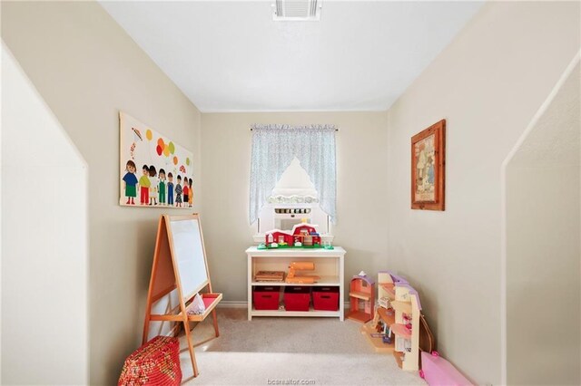 rec room featuring carpet flooring and visible vents