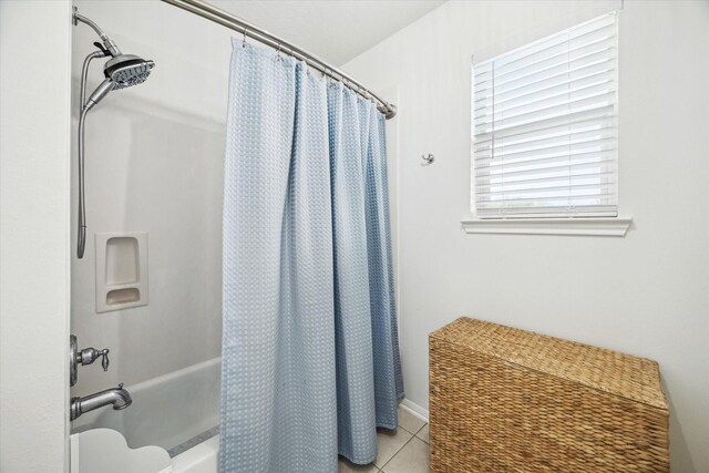 full bathroom with tile patterned flooring and shower / bath combo