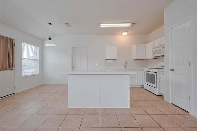 kitchen with visible vents, white appliances, light countertops, white cabinetry, and light tile patterned floors
