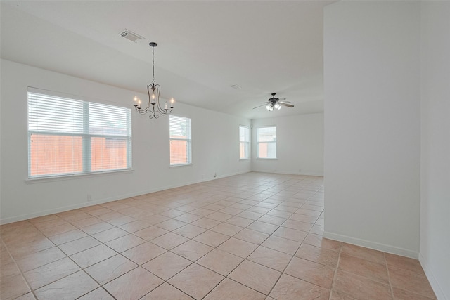 empty room featuring visible vents, baseboards, ceiling fan with notable chandelier, and light tile patterned floors