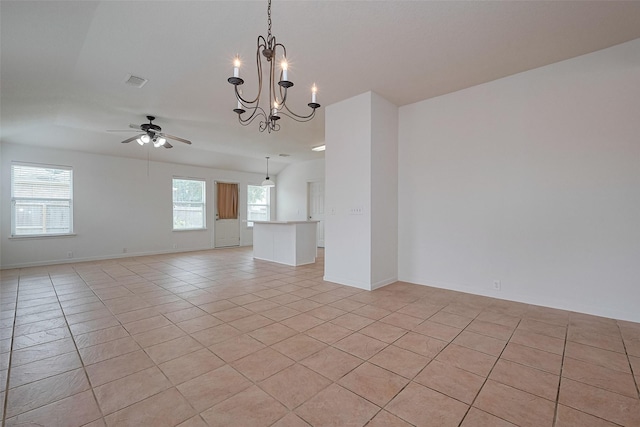 unfurnished room with light tile patterned floors, baseboards, ceiling fan with notable chandelier, and visible vents
