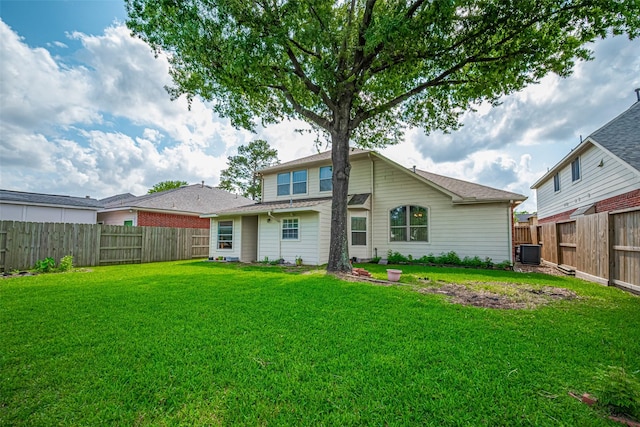 526 Majestic Ridge Dr, Houston, TX 77049 - back of house with a lawn, a fenced backyard, and central AC