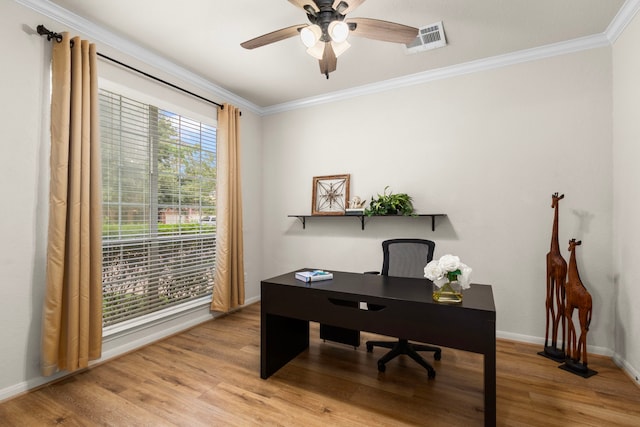 office with ceiling fan, light wood-style floors, baseboards, visible vents, and ornamental molding