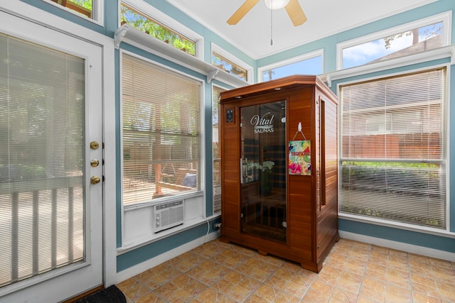 unfurnished sunroom with cooling unit and a wealth of natural light