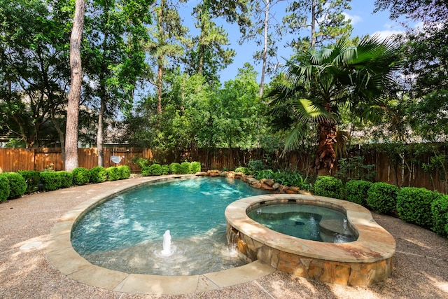 view of pool featuring an in ground hot tub, a fenced in pool, and a fenced backyard