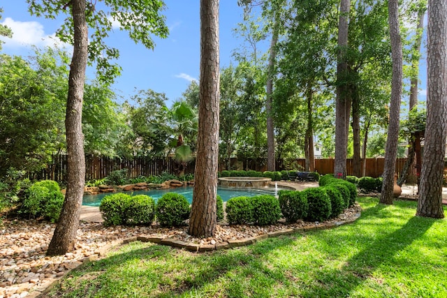 view of yard with a fenced in pool and a fenced backyard