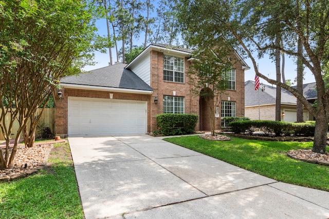 traditional home with roof with shingles, brick siding, a garage, a front yard, and concrete driveway