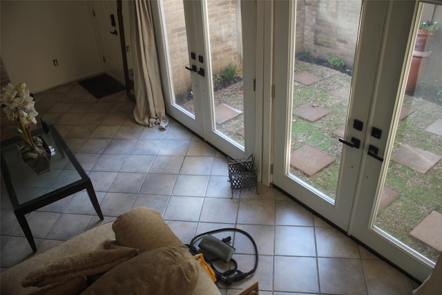 6106 W Airport Blvd Unit 18, Houston, TX 77035 - entryway featuring french doors, healthy amount of natural light, and light tile patterned floors