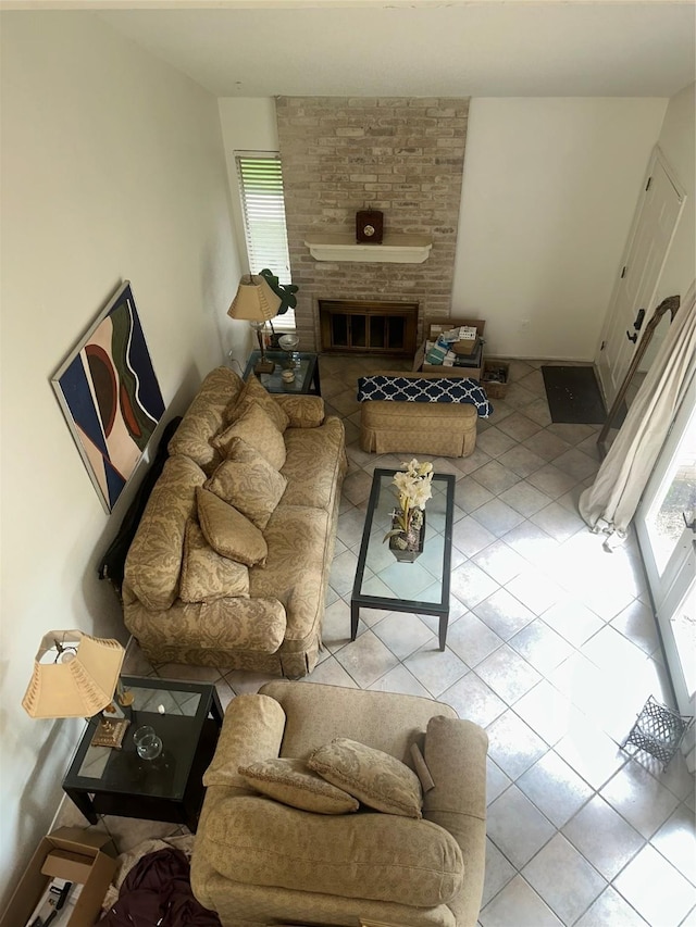 6106 W Airport Blvd Unit 18, Houston, TX 77035 - living room with tile patterned floors and a brick fireplace