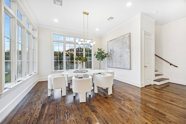 dining space featuring crown molding, visible vents, and dark wood-type flooring