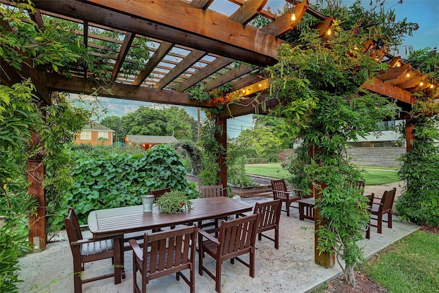 view of patio with a pergola, fence, and outdoor dining area