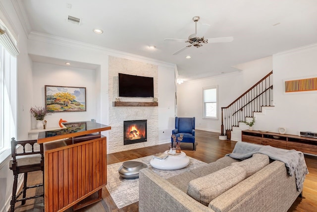1267 Sopris Dr, Houston, TX 77077 - living room featuring ornamental molding, a stone fireplace, wood finished floors, stairway, and ceiling fan