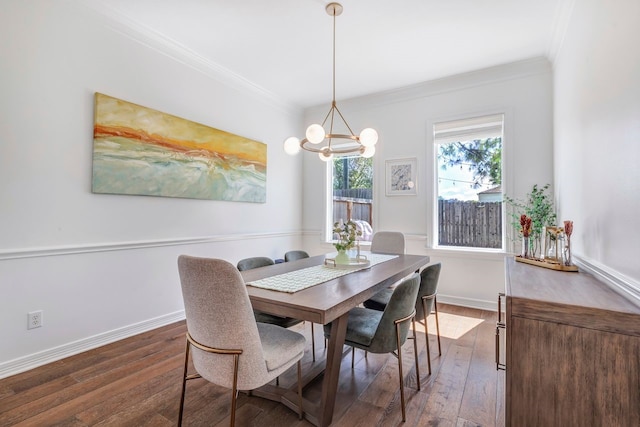 1267 Sopris Dr, Houston, TX 77077 - dining room featuring crown molding, a chandelier, dark wood finished floors, and baseboards