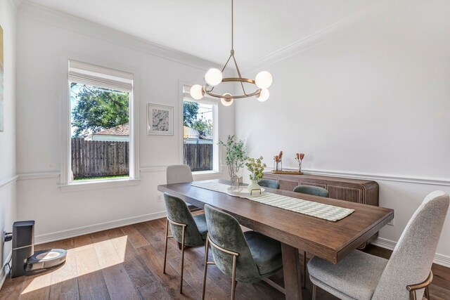 1267 Sopris Dr, Houston, TX 77077 - dining space with crown molding, a chandelier, wood finished floors, and baseboards