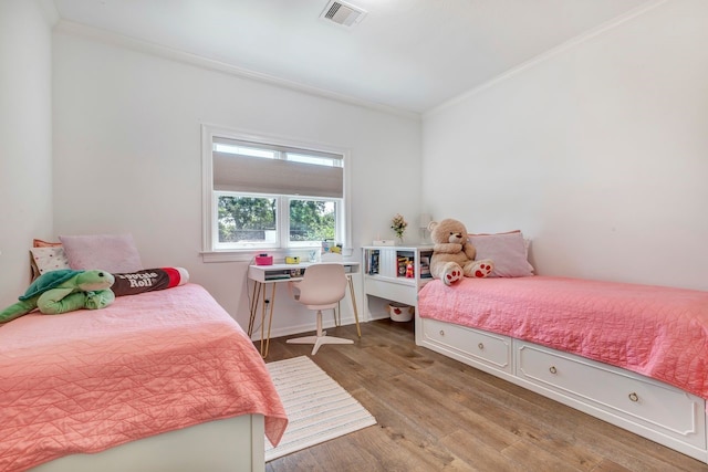 1267 Sopris Dr, Houston, TX 77077 - bedroom with crown molding and light wood-style floors