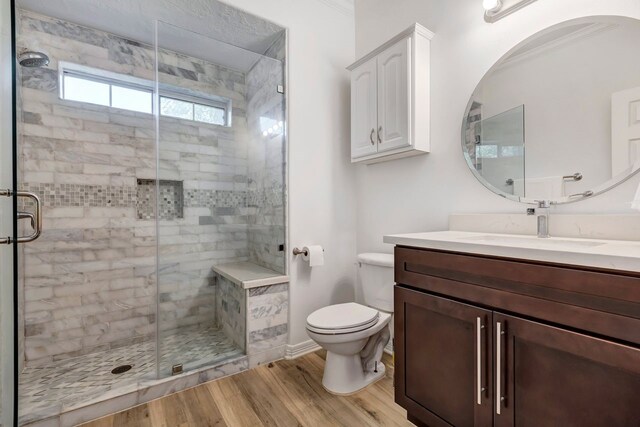1267 Sopris Dr, Houston, TX 77077 - full bath featuring wood finished floors, toilet, a stall shower, vanity, and crown molding