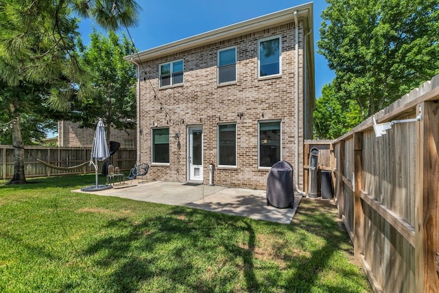 1267 Sopris Dr, Houston, TX 77077 - rear view of house featuring brick siding and a patio area